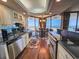 A kitchen boasts granite counters and ocean views from the eat-in dining area at 9650 Shore Dr. # 810, Myrtle Beach, SC 29572