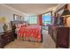 The main bedroom has ocean views and traditional furnishings at 9650 Shore Dr. # 810, Myrtle Beach, SC 29572