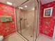 Modern tiled shower with glass enclosure in a unique and colorful bathroom setting at 9650 Shore Dr. # 810, Myrtle Beach, SC 29572