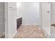 Well-lit bathroom featuring a shower, shelving, and dark cabinets at 993 Cherrystone Loop, Conway, SC 29526