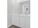 Bright bathroom featuring a dual sink vanity with white cabinets and a large mirror at 993 Cherrystone Loop, Conway, SC 29526