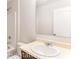 Standard bathroom vanity with a sink, mirror, toilet and shower with beige and white tile at 993 Cherrystone Loop, Conway, SC 29526