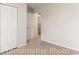 Neutral bedroom showing the closet, door, neutral carpeting and walls at 993 Cherrystone Loop, Conway, SC 29526