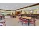 Spacious clubhouse with tables, chairs, and a bar area for social gatherings at 993 Cherrystone Loop, Conway, SC 29526