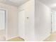Bright hallway featuring white walls and neutral-colored carpeting, with doors leading to other rooms at 993 Cherrystone Loop, Conway, SC 29526