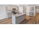 Modern kitchen featuring stainless steel appliances, granite countertops, and a large center island at 993 Cherrystone Loop, Conway, SC 29526