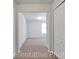 Bedroom featuring neutral-toned walls and carpeted floors with a view into an adjoining room at 994 Cherrystone Loop, Conway, SC 29526