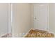 Bright foyer with a white front door and hardwood floors at 994 Cherrystone Loop, Conway, SC 29526