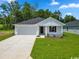 Charming single-story home featuring a well-manicured lawn and a paved driveway at 994 Cherrystone Loop, Conway, SC 29526