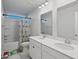 Bright bathroom with double sinks and tub/shower combo at 101 Cowan Pl., Myrtle Beach, SC 29588