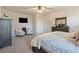Cozy bedroom featuring plush carpet, neutral decor, a ceiling fan, and bright natural light at 101 Cowan Pl., Myrtle Beach, SC 29588