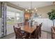 Elegant dining room featuring a large window and stylish chandelier at 101 Cowan Pl., Myrtle Beach, SC 29588