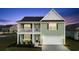 Charming two-story home boasting a welcoming porch and a two-car garage at 101 Cowan Pl., Myrtle Beach, SC 29588