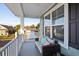 Inviting front porch with comfortable seating and pleasant neighborhood views at 101 Cowan Pl., Myrtle Beach, SC 29588