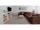 Inviting living area with a large sectional sofa, wall-mounted TV, and stylish storage at 101 Cowan Pl., Myrtle Beach, SC 29588