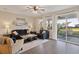 Bright living room featuring hardwood floors, comfortable sofas, and access to the outdoor living space at 101 Cowan Pl., Myrtle Beach, SC 29588