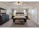 Spacious main bedroom with a large bed, dark wood furniture, and soft carpet flooring at 101 Cowan Pl., Myrtle Beach, SC 29588