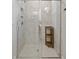 Elegant glass enclosed shower featuring marble tile and a built-in corner shelf at 101 Cowan Pl., Myrtle Beach, SC 29588