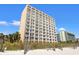 Behold this multi-story building boasting a facade with countless balconies, perfect for enjoying scenic views at 1207 S Ocean Blvd. S # 51107, Myrtle Beach, SC 29577