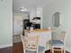 A compact kitchen features a breakfast bar, range oven, microwave, and refrigerator at 1207 S Ocean Blvd. S # 51107, Myrtle Beach, SC 29577