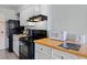 Efficiency kitchen has a range oven, microwave, and refrigerator, perfect for preparing vacation meals at 1207 S Ocean Blvd. S # 51107, Myrtle Beach, SC 29577