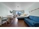 This inviting living area has a comfy sofa, dining table, and access to the balcony with ocean views at 1207 S Ocean Blvd. S # 51107, Myrtle Beach, SC 29577