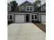 Charming townhome with a two-car garage and well-manicured landscaping at 1213 American Shad Dr. # 37, Conway, SC 29526