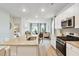 Open concept kitchen with stainless appliances and a view of the dining and living area at 1213 American Shad Dr. # 37, Conway, SC 29526
