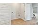 A simple laundry room with wood-look flooring, white walls, and a laundry hookup at 1213 American Shad Dr. # 37, Conway, SC 29526