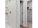 Bright tiled walk-in shower with shelves and next to doorway to walk-in closet at 1213 American Shad Dr. # 37, Conway, SC 29526