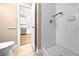 Bathroom with glass-enclosed shower. Kitchen is visible through doorway at 1516 Saint George Ln., Myrtle Beach, SC 29588