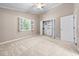Bedroom features carpet, closet, white trim, ceiling fan, and window with open shutters at 1516 Saint George Ln., Myrtle Beach, SC 29588