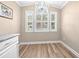 Breakfast nook with a chandelier and many windows that let in natural light and backyard views at 1516 Saint George Ln., Myrtle Beach, SC 29588