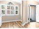 Breakfast nook with chandelier and many windows that provide natural light and views to the yard at 1516 Saint George Ln., Myrtle Beach, SC 29588