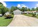 Inviting single-Gathering home with a two-car garage, manicured lawn, and a welcoming patio seating area at 1516 Saint George Ln., Myrtle Beach, SC 29588