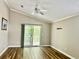 Spacious living room with wood floors and sliding glass doors leading to the outside at 1516 Saint George Ln., Myrtle Beach, SC 29588
