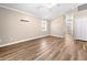 Spacious living room with wood-look flooring, neutral paint and plenty of natural light at 1516 Saint George Ln., Myrtle Beach, SC 29588