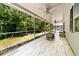 Large screened porch overlooking the private backyard at 1516 Saint George Ln., Myrtle Beach, SC 29588