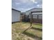 Backyard featuring wooden swing, shed, house with wooden deck, and fenced-in backyard at 212 Weyburn St., Myrtle Beach, SC 29579