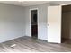 Open bedroom with doorway to bathroom and closet at 212 Weyburn St., Myrtle Beach, SC 29579