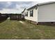 Charming home featuring vinyl siding, black shutters, and a lakeside deck at 212 Weyburn St., Myrtle Beach, SC 29579