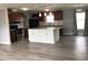 Modern kitchen with stainless steel appliances, white island, and granite countertops at 212 Weyburn St., Myrtle Beach, SC 29579