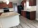 Renovated kitchen featuring an island with granite countertops and ample storage at 212 Weyburn St., Myrtle Beach, SC 29579