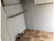 Laundry room with built-in shelves and tile flooring, providing storage and convenience for laundry tasks at 212 Weyburn St., Myrtle Beach, SC 29579