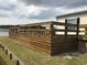 Large wooden deck perfect for outdoor relaxation and entertaining with views of the surrounding landscape at 212 Weyburn St., Myrtle Beach, SC 29579