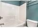 Bright bathroom featuring teal walls, a shower/tub combo, and mounted rack at 237 Chesapeake Ln., Murrells Inlet, SC 29576