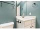 Bright bathroom with teal walls, decorative vanity, and modern fixtures at 237 Chesapeake Ln., Murrells Inlet, SC 29576