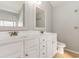 Well-lit bathroom featuring double sinks, white cabinets and framed mirrors at 237 Chesapeake Ln., Murrells Inlet, SC 29576