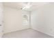 Clean bedroom with neutral paint and carpet, ceiling fan, and window at 237 Chesapeake Ln., Murrells Inlet, SC 29576