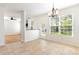 Bright dining room with tile floors and backyard access at 237 Chesapeake Ln., Murrells Inlet, SC 29576